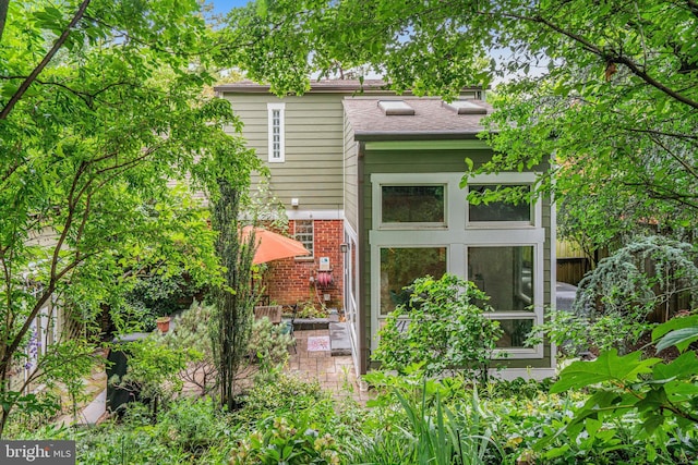 2005 S Quincy St, Arlington, VA 22204 - rear view of property featuring brick siding and a patio area