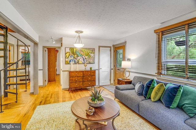 2005 S Quincy St, Arlington, VA 22204 - living area featuring stairs, light wood finished floors, and a textured ceiling