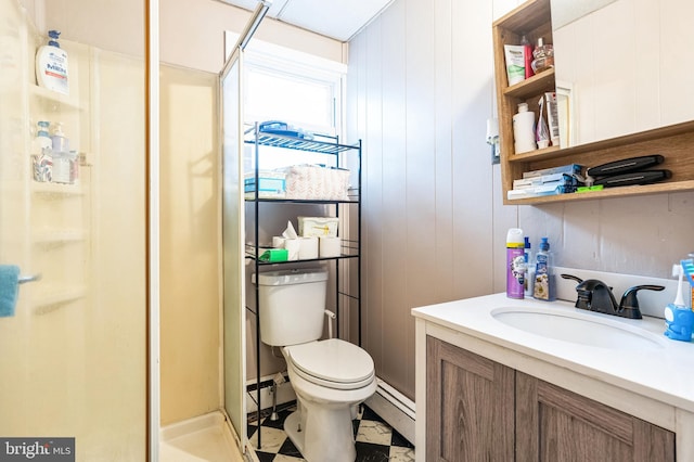 full bath featuring a shower stall, toilet, baseboard heating, and vanity