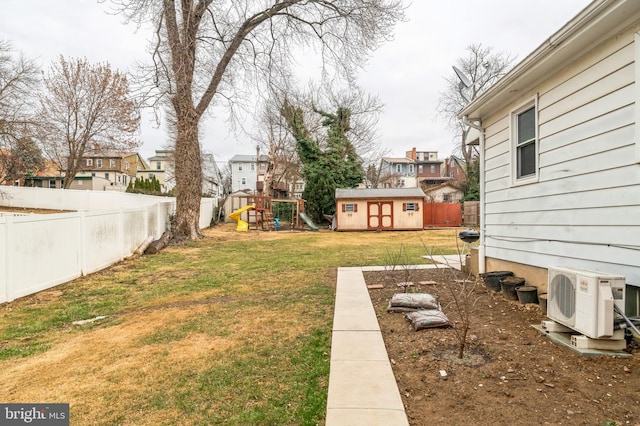 view of yard featuring a cooling unit, a playground, and a residential view