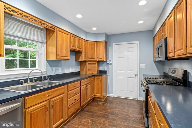 23115 Mt Cloud Rd, Bowling Green, VA 22427 - kitchen featuring stainless steel appliances, a sink, dark countertops, dark wood-style flooring, and brown cabinets