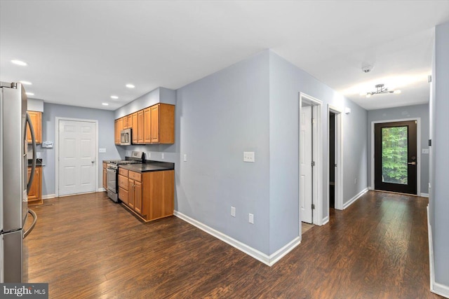 23115 Mt Cloud Rd, Bowling Green, VA 22427 - kitchen featuring stainless steel appliances, brown cabinetry, dark wood finished floors, recessed lighting, and baseboards