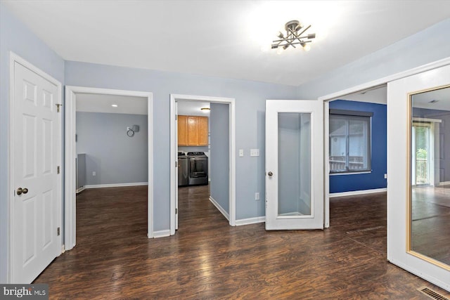 23115 Mt Cloud Rd, Bowling Green, VA 22427 - empty room with washer and dryer, wood finished floors, and baseboards