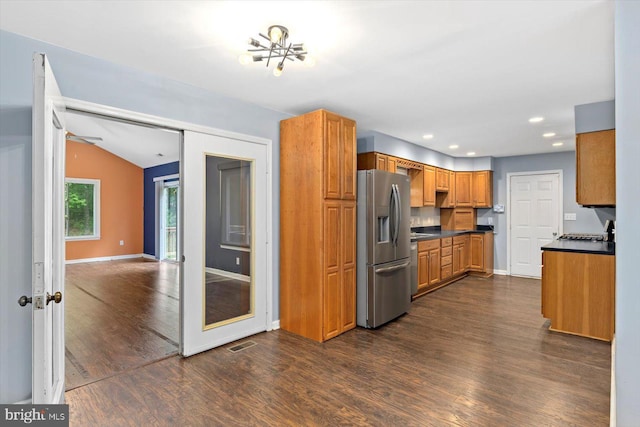 23115 Mt Cloud Rd, Bowling Green, VA 22427 - kitchen featuring stainless steel refrigerator with ice dispenser, dark wood-type flooring, baseboards, dark countertops, and brown cabinets