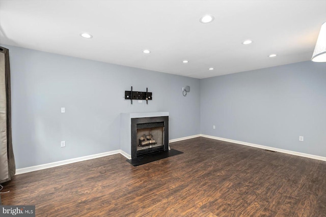 23115 Mt Cloud Rd, Bowling Green, VA 22427 - unfurnished living room with dark wood-style floors, recessed lighting, a fireplace with flush hearth, and baseboards