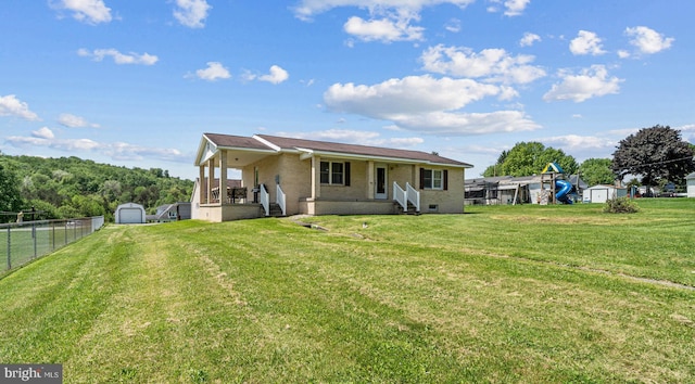 135 Irvin St, Brisbin, PA 16620 - back of property with a porch, brick siding, driveway, and crawl space