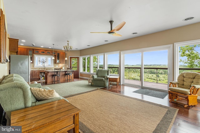 9207 Douglas Rd, Olanta, PA 16863 - living room featuring ceiling fan, wood finished floors, recessed lighting, and a chandelier