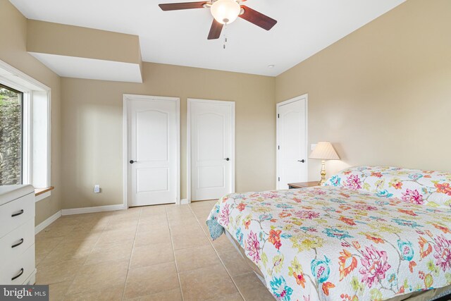 9207 Douglas Rd, Olanta, PA 16863 - bedroom with baseboards, light tile patterned floors, and a ceiling fan