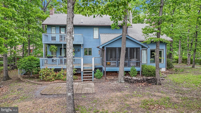 200 Sunset Cir, Cross Junction, VA 22625 - rear view of house with a shingled roof, a balcony, a chimney, a sunroom, and a wooden deck