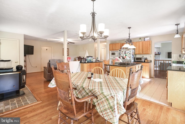 200 Sunset Cir, Cross Junction, VA 22625 - dining space featuring a chandelier and light wood finished floors