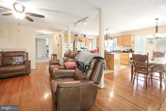 200 Sunset Cir, Cross Junction, VA 22625 - living room with a chandelier, a ceiling fan, light wood-style flooring, and a textured ceiling