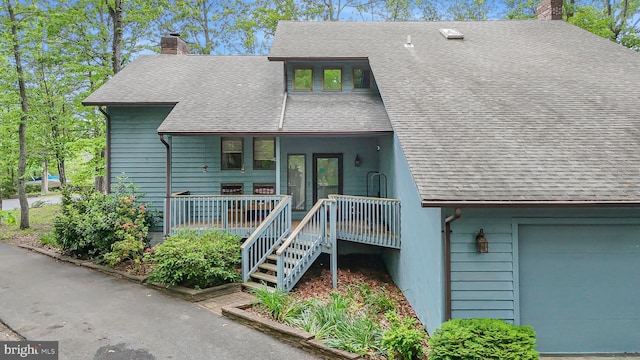 200 Sunset Cir, Cross Junction, VA 22625 - a-frame style home with a chimney, covered porch, roof with shingles, and a garage