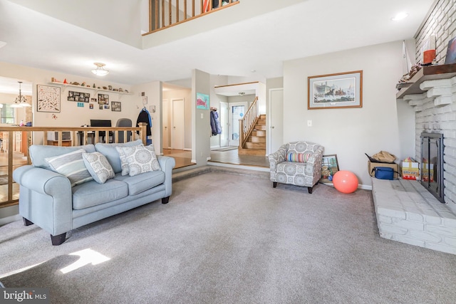 200 Sunset Cir, Cross Junction, VA 22625 - living area with a brick fireplace, carpet floors, and stairs