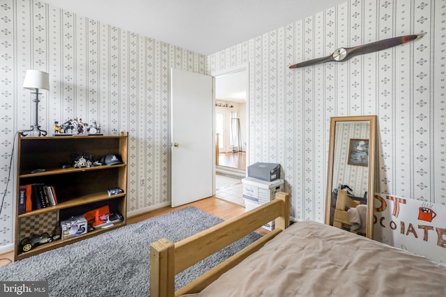 200 Sunset Cir, Cross Junction, VA 22625 - bedroom featuring wallpapered walls and wood finished floors
