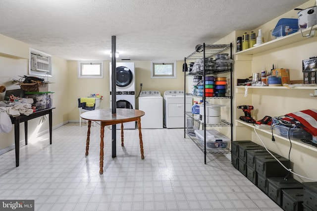 200 Sunset Cir, Cross Junction, VA 22625 - laundry area featuring tile patterned floors, stacked washer and clothes dryer, a wall mounted AC, a textured ceiling, and baseboards