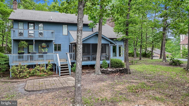 200 Sunset Cir, Cross Junction, VA 22625 - rear view of property featuring a shingled roof, a chimney, a sunroom, a balcony, and a wooden deck