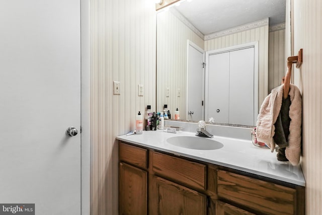 200 Sunset Cir, Cross Junction, VA 22625 - bathroom featuring crown molding, vanity, and wallpapered walls