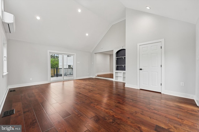 unfurnished living room with an AC wall unit, hardwood / wood-style flooring, high vaulted ceiling, baseboards, and recessed lighting