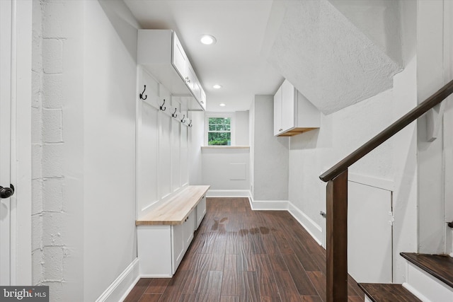 mudroom with baseboards, dark wood-style floors, and recessed lighting