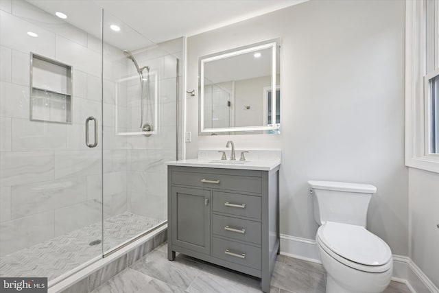 full bathroom featuring a stall shower, toilet, baseboards, vanity, and recessed lighting