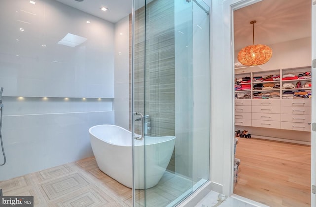 104 W Buckingham Dr, Rehoboth Beach, DE 19971 - full bath with a shower stall, a soaking tub, and a spacious closet