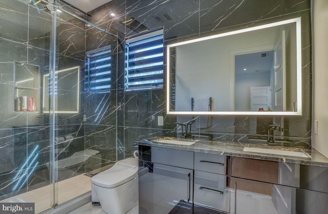 104 W Buckingham Dr, Rehoboth Beach, DE 19971 - full bathroom with tile walls, double vanity, a marble finish shower, toilet, and tasteful backsplash