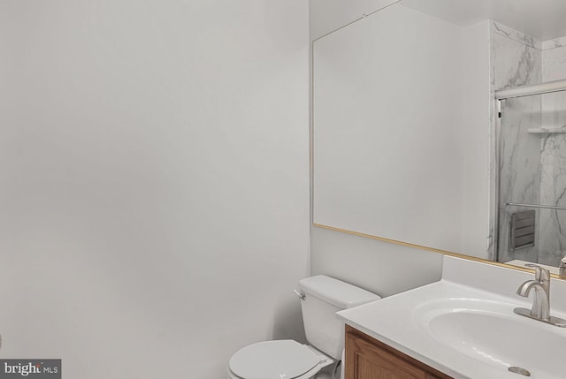 6510 Lake Park Dr Unit 2E/201, Greenbelt, MD 20770 - bathroom featuring a marble finish shower, vanity, and toilet