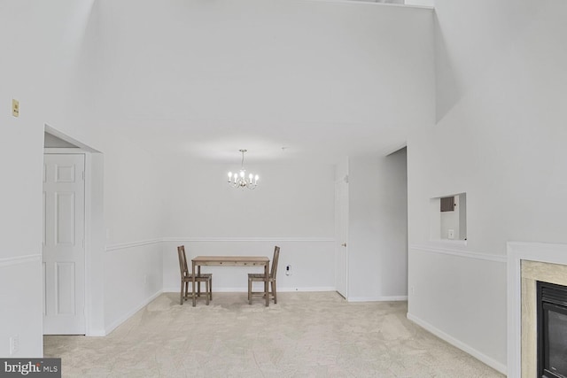 6510 Lake Park Dr Unit 2E/201, Greenbelt, MD 20770 - carpeted dining space with a chandelier, a high end fireplace, and baseboards