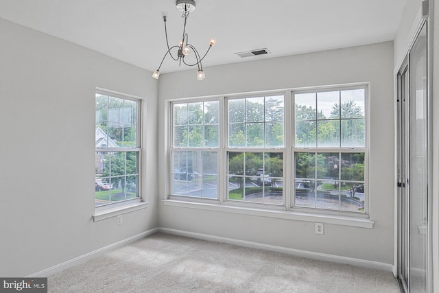 6510 Lake Park Dr Unit 2E/201, Greenbelt, MD 20770 - spare room with baseboards, a chandelier, and light colored carpet