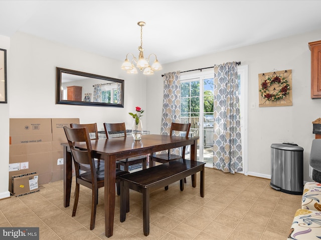 7737 Overhill Rd, Glen Burnie, MD 21060 - dining space featuring a chandelier and baseboards