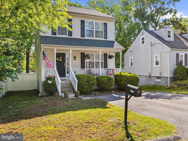 7737 Overhill Rd, Glen Burnie, MD 21060 - view of front of home with covered porch and a shingled roof