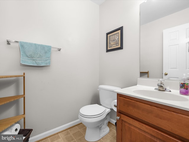 7737 Overhill Rd, Glen Burnie, MD 21060 - half bath with baseboards, vanity, and toilet
