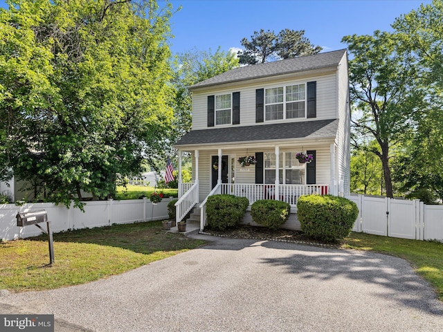 7737 Overhill Rd, Glen Burnie, MD 21060 - view of front of property featuring a gate, covered porch, and a shingled roof
