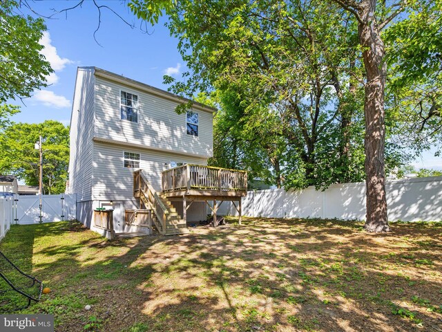 7737 Overhill Rd, Glen Burnie, MD 21060 - rear view of house with a gate, a wooden deck, stairs, and a fenced backyard