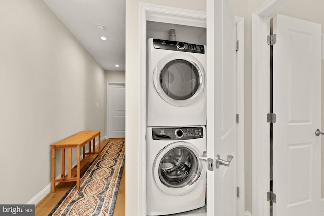 4521 Clay St NE, Washington, DC 20019 - laundry room with stacked washer / drying machine, baseboards, light wood-type flooring, and recessed lighting