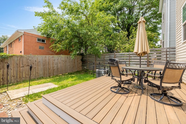 4521 Clay St NE, Washington, DC 20019 - wooden terrace with outdoor dining area and a fenced backyard