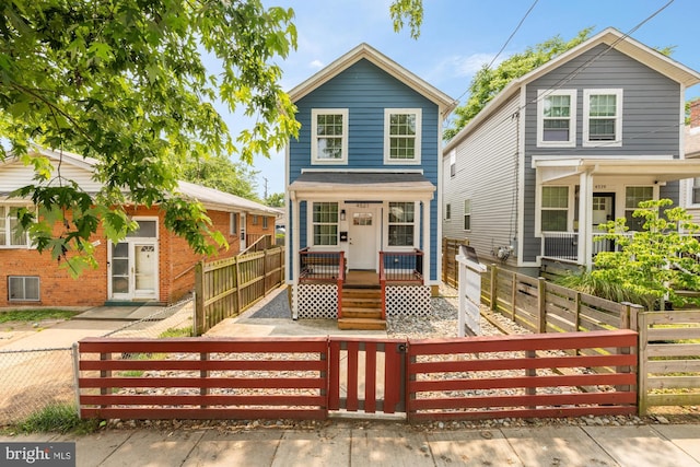 4521 Clay St NE, Washington, DC 20019 - view of front of property with covered porch, a fenced front yard, and a gate