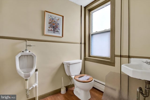 166 Tulpehocken St, Bernville, PA 19506 - bathroom with a baseboard radiator, plenty of natural light, toilet, and wood finished floors