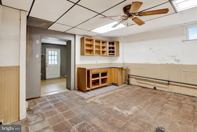 166 Tulpehocken St, Bernville, PA 19506 - bar area with wainscoting, healthy amount of natural light, a ceiling fan, and wooden walls