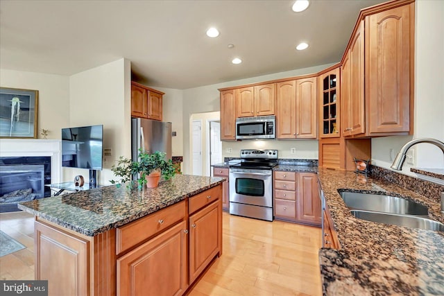 1050 Crest Way Unit 403, York, PA 17403 - kitchen with stainless steel appliances, a sink, glass insert cabinets, recessed lighting, and a kitchen island