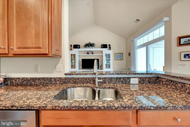 1050 Crest Way Unit 403, York, PA 17403 - kitchen featuring a sink, dark stone counters, vaulted ceiling, and stainless steel dishwasher