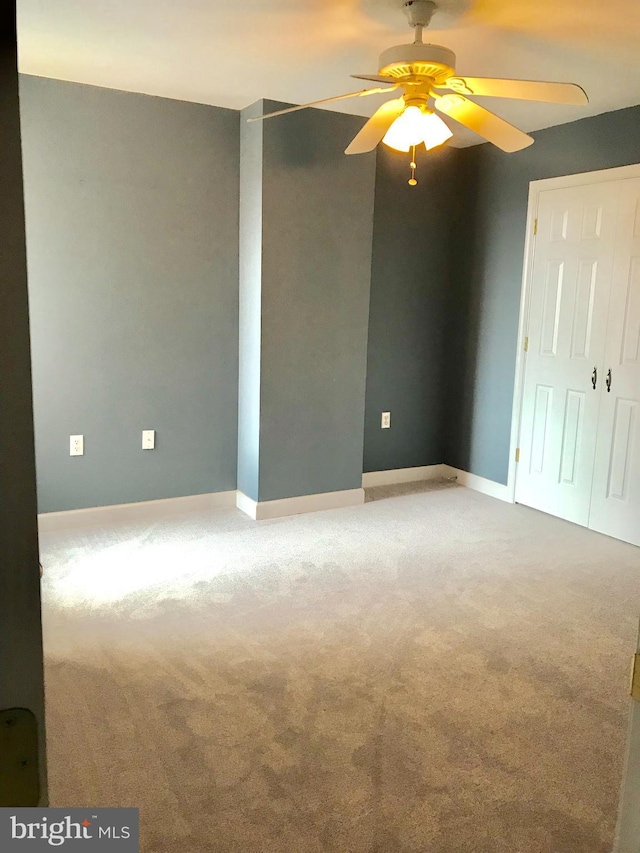 2205 E Baltimore St, Baltimore, MD 21231 - carpeted spare room featuring a ceiling fan and baseboards