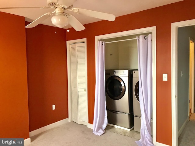 2205 E Baltimore St, Baltimore, MD 21231 - laundry area featuring washing machine and clothes dryer, light colored carpet, ceiling fan, and baseboards