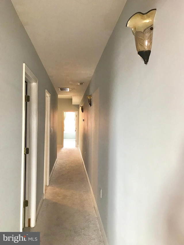 2205 E Baltimore St, Baltimore, MD 21231 - hallway featuring light carpet and baseboards