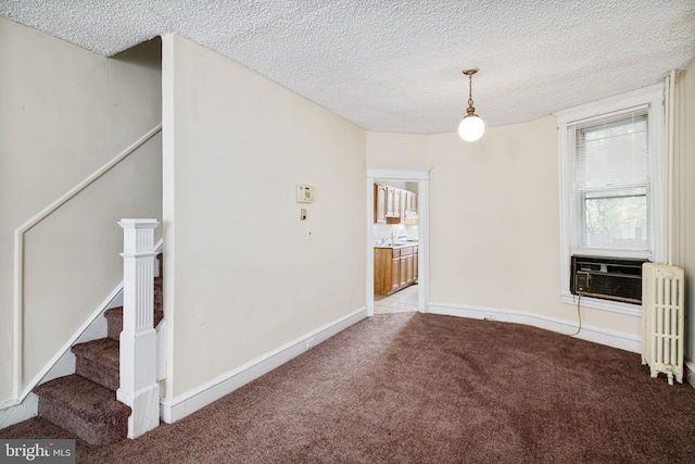 862 E Schiller St, Philadelphia, PA 19134 - carpeted empty room with radiator, a textured ceiling, cooling unit, stairway, and a sink