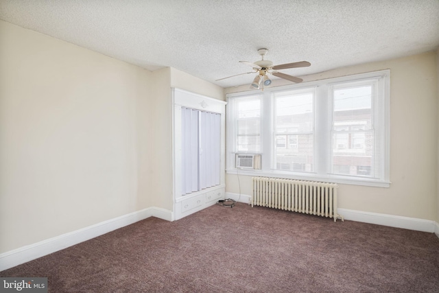 862 E Schiller St, Philadelphia, PA 19134 - spare room featuring radiator heating unit, carpet flooring, a textured ceiling, ceiling fan, and baseboards