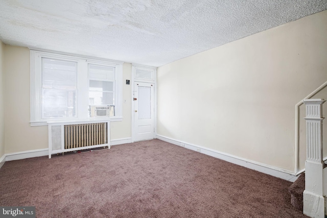 862 E Schiller St, Philadelphia, PA 19134 - empty room featuring radiator, carpet floors, a textured ceiling, and baseboards