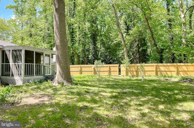 view of yard with a sunroom