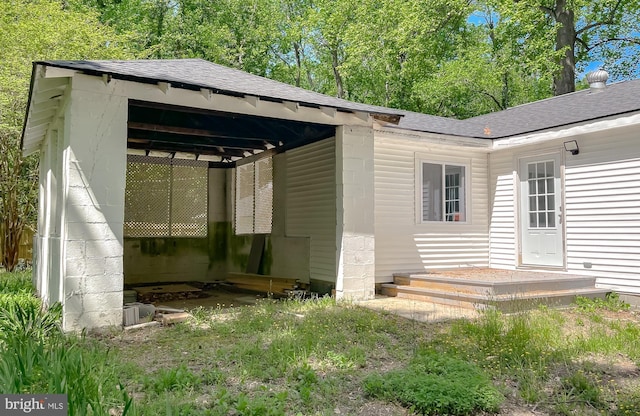 view of outbuilding with a carport