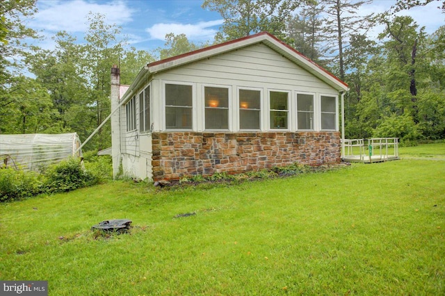 38 Mountain Rd, Orrtanna, PA 17353 - view of property exterior featuring stone siding, a yard, and a chimney